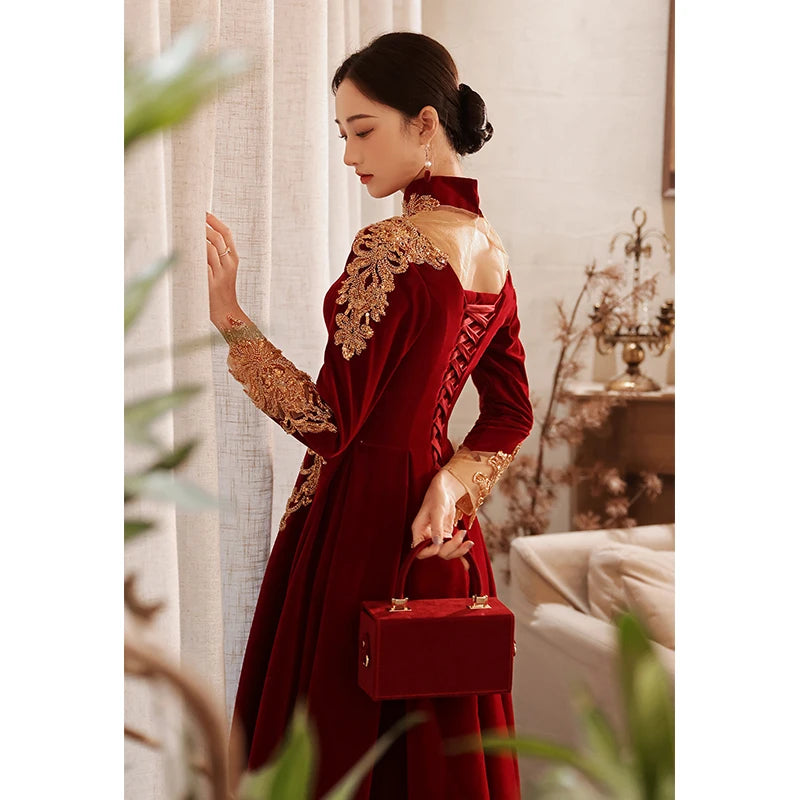 Elegant Red Velvet Gown With Gold Embroidery
